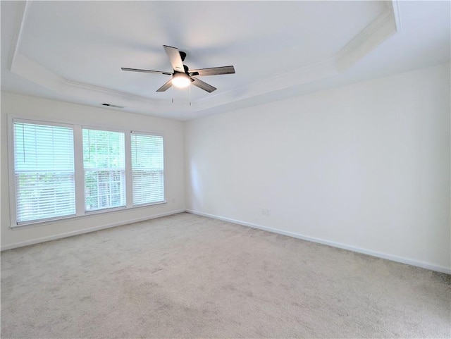 580 Hammersmith Dr, Suwanee, GA 30024 - empty room featuring a raised ceiling, a ceiling fan, light carpet, and ornamental molding