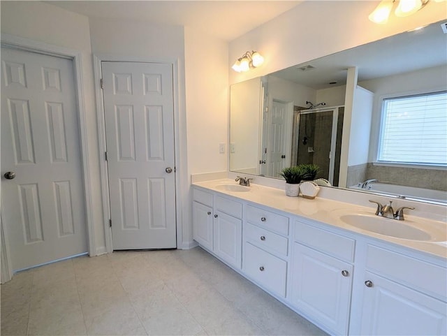 580 Hammersmith Dr, Suwanee, GA 30024 - bathroom featuring a shower stall, a garden tub, double vanity, and tile patterned flooring