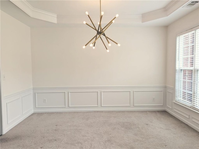 580 Hammersmith Dr, Suwanee, GA 30024 - empty room with a chandelier, crown molding, a tray ceiling, light carpet, and a decorative wall