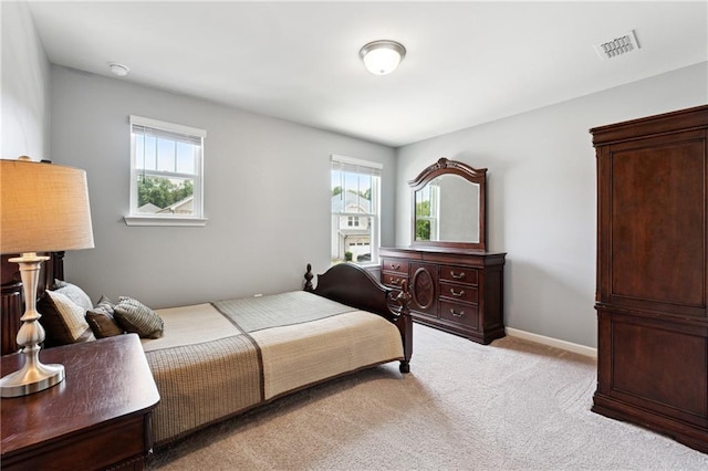 519 Magnolia Dr, Dawsonville, GA 30534 - bedroom featuring multiple windows, light carpet, and baseboards
