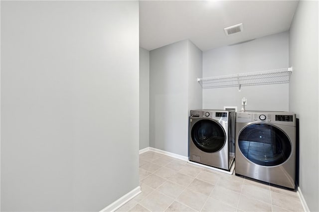 519 Magnolia Dr, Dawsonville, GA 30534 - washroom with separate washer and dryer, baseboards, and light tile patterned flooring