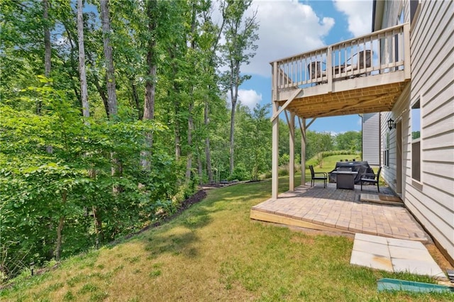 519 Magnolia Dr, Dawsonville, GA 30534 - view of green lawn with a patio area and a wooden deck