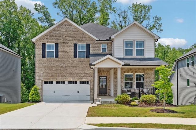 519 Magnolia Dr, Dawsonville, GA 30534 - view of front of property with brick siding, a garage, concrete driveway, a porch, and a front lawn