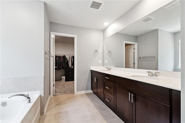 519 Magnolia Dr, Dawsonville, GA 30534 - full bath with a garden tub, double vanity, a walk in closet, tile patterned flooring, and baseboards