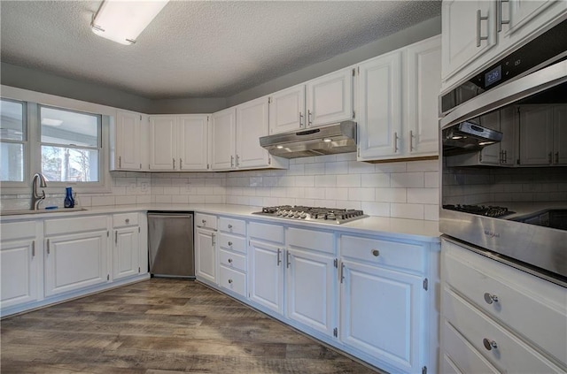 317 Shenandoah Dr NE, Calhoun, GA 30701 - kitchen featuring stainless steel appliances, a sink, under cabinet range hood, white cabinets, and a textured ceiling
