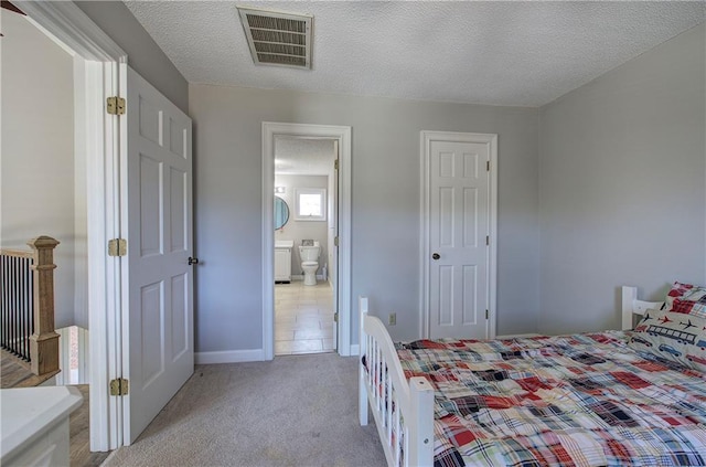 317 Shenandoah Dr NE, Calhoun, GA 30701 - bedroom with light colored carpet, a textured ceiling, baseboards, and connected bathroom
