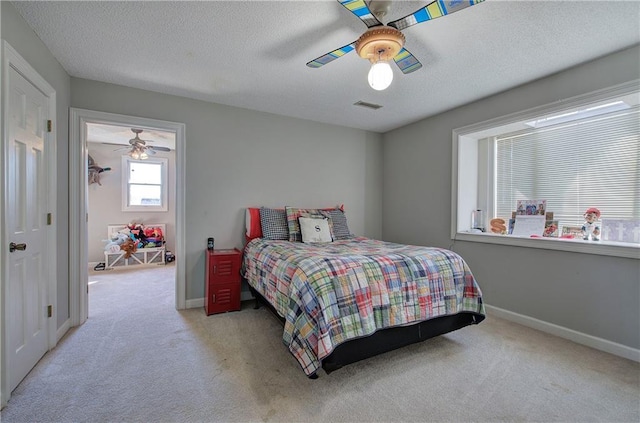 317 Shenandoah Dr NE, Calhoun, GA 30701 - bedroom with carpet, baseboards, a textured ceiling, and a ceiling fan