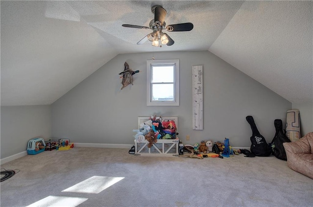 317 Shenandoah Dr NE, Calhoun, GA 30701 - recreation room featuring carpet, vaulted ceiling, a textured ceiling, a ceiling fan, and baseboards
