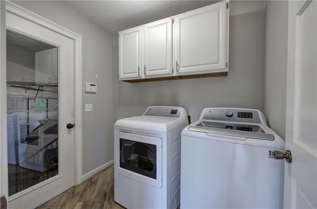 317 Shenandoah Dr NE, Calhoun, GA 30701 - washroom with separate washer and dryer, cabinet space, wood finished floors, a textured ceiling, and baseboards