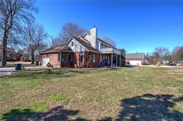 317 Shenandoah Dr NE, Calhoun, GA 30701 - view of side of property with a garage, a chimney, a yard, concrete driveway, and brick siding
