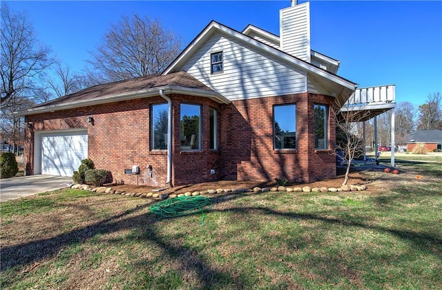 317 Shenandoah Dr NE, Calhoun, GA 30701 - view of property exterior with a garage, brick siding, a chimney, a lawn, and concrete driveway