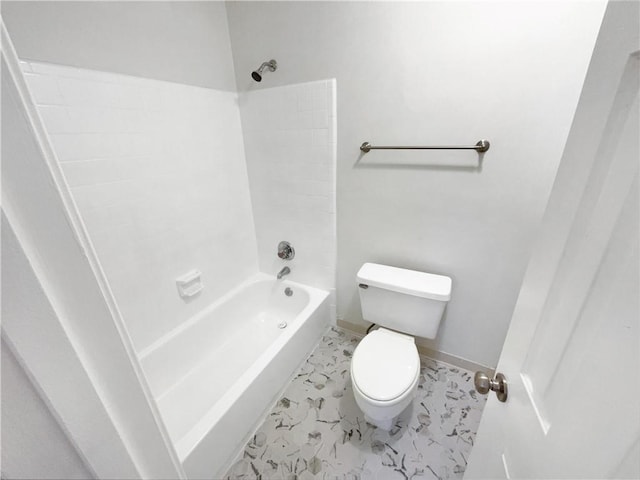 bathroom featuring toilet and  shower combination