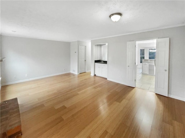 unfurnished living room featuring light hardwood / wood-style floors