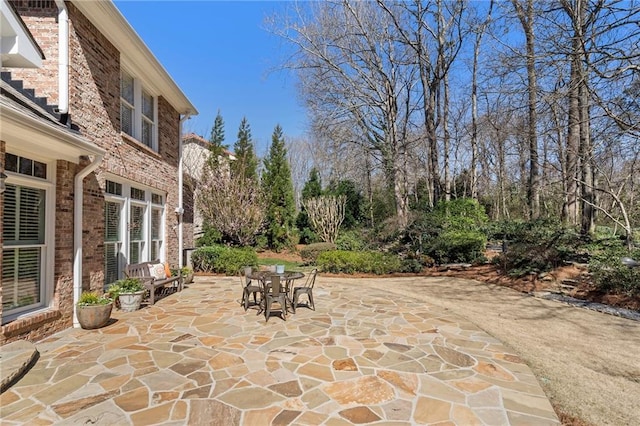 view of patio featuring outdoor dining area