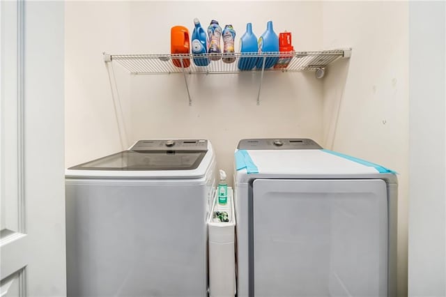 laundry room with laundry area and washer and clothes dryer