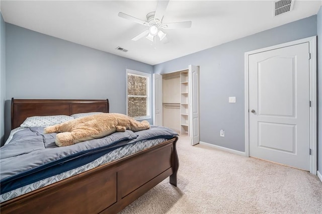 bedroom with light colored carpet, visible vents, ceiling fan, and baseboards