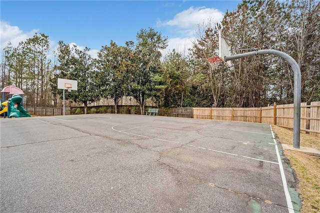 view of basketball court featuring community basketball court and fence