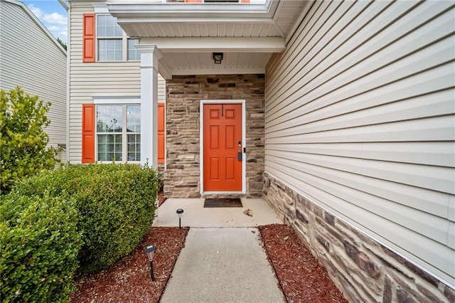 view of exterior entry with stone siding