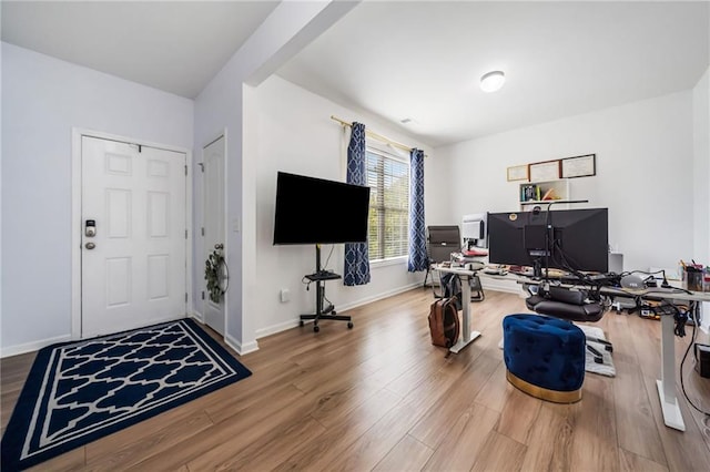 office area with wood finished floors and baseboards