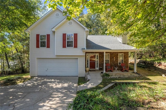 view of front of house featuring a garage and a porch