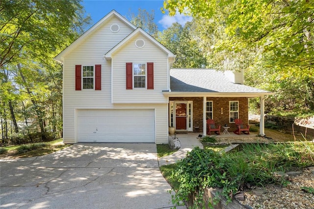 view of front of home featuring a garage and covered porch