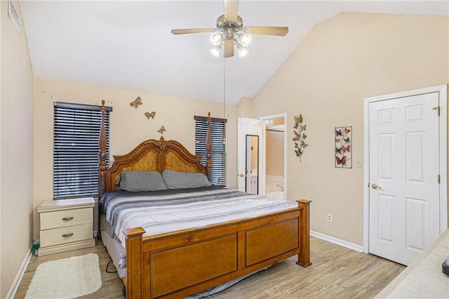 bedroom with ceiling fan, light wood-type flooring, and high vaulted ceiling