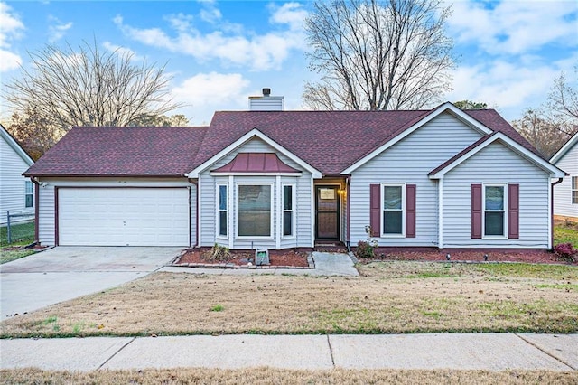 view of front of home featuring a garage and a front lawn