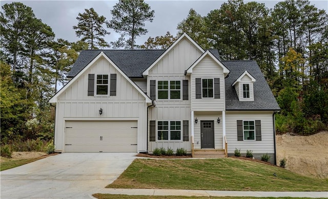 view of front facade featuring a front yard and a garage