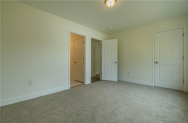 unfurnished bedroom with light carpet