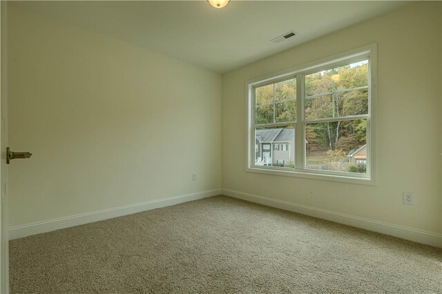 view of carpeted spare room