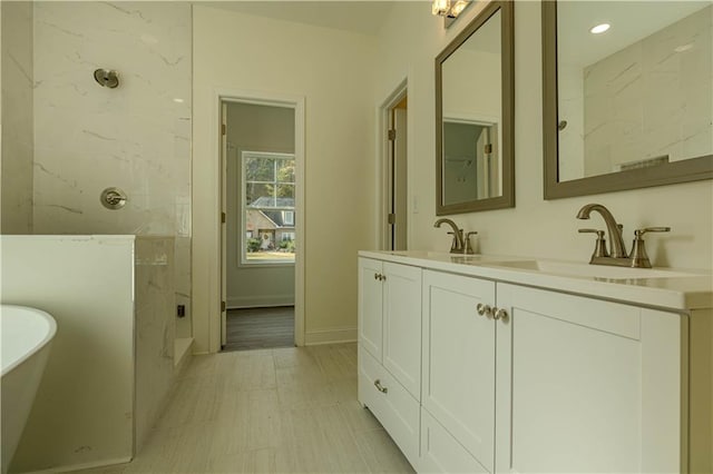 bathroom with vanity and plus walk in shower