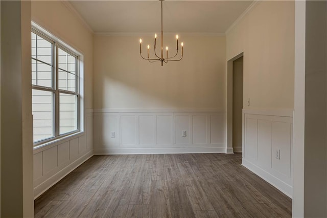 unfurnished dining area featuring ornamental molding, a wealth of natural light, and dark hardwood / wood-style flooring