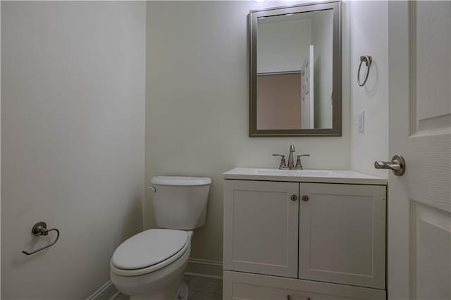 bathroom featuring toilet and vanity