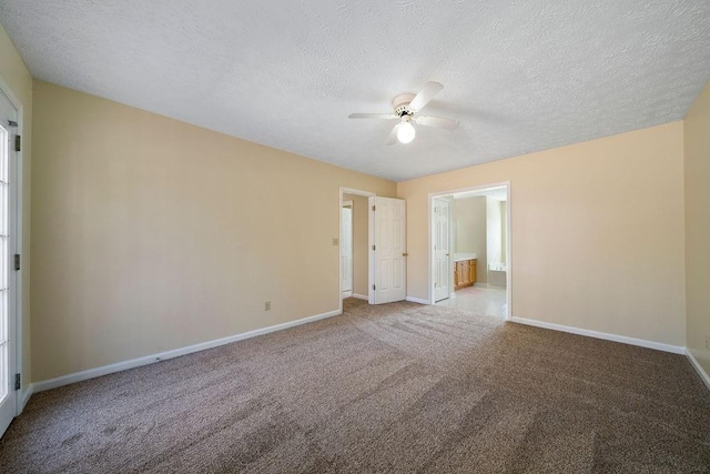 carpeted empty room with a textured ceiling and ceiling fan