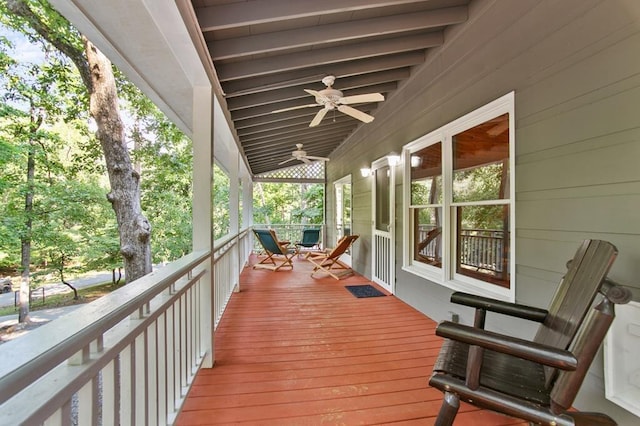 wooden terrace featuring ceiling fan