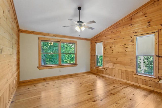 spare room with ceiling fan, lofted ceiling, light hardwood / wood-style flooring, and plenty of natural light