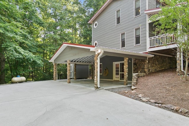 view of home's exterior featuring a carport