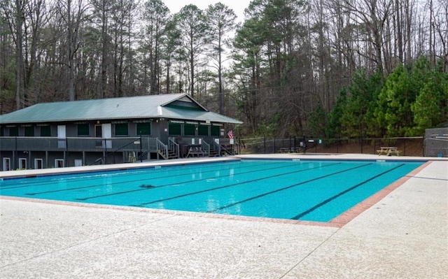 view of swimming pool featuring a patio