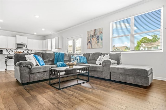 3135 Ellenton Dr, Lithia Springs, GA 30122 - living room with crown molding, recessed lighting, and hardwood / wood-style floors