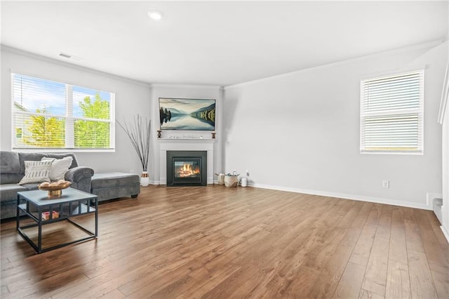 3135 Ellenton Dr, Lithia Springs, GA 30122 - living area with baseboards, ornamental molding, and hardwood / wood-style floors