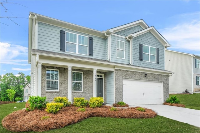 3135 Ellenton Dr, Lithia Springs, GA 30122 - view of front of home featuring brick siding, a garage, driveway, and a front yard