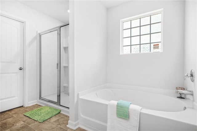 3135 Ellenton Dr, Lithia Springs, GA 30122 - full bathroom featuring a stall shower and a bath