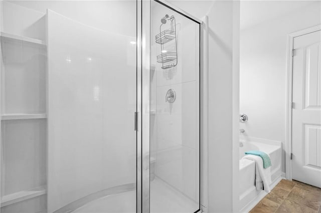 3135 Ellenton Dr, Lithia Springs, GA 30122 - bathroom with a shower stall and a garden tub