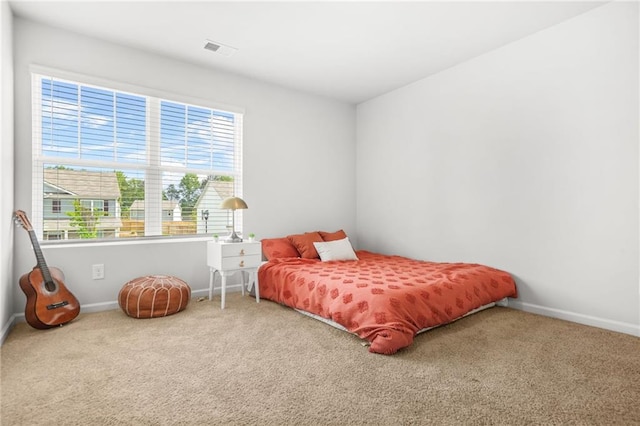 3135 Ellenton Dr, Lithia Springs, GA 30122 - carpeted bedroom featuring baseboards and visible vents