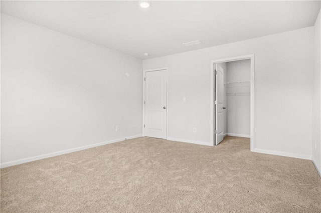 3135 Ellenton Dr, Lithia Springs, GA 30122 - unfurnished bedroom with a closet, baseboards, light colored carpet, recessed lighting, and a spacious closet