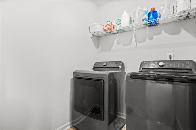 3135 Ellenton Dr, Lithia Springs, GA 30122 - laundry area with separate washer and dryer, baseboards, and laundry area