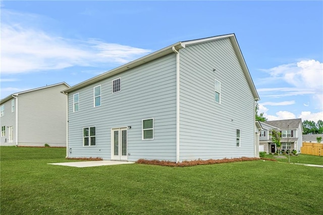 3135 Ellenton Dr, Lithia Springs, GA 30122 - back of house featuring a lawn and a patio