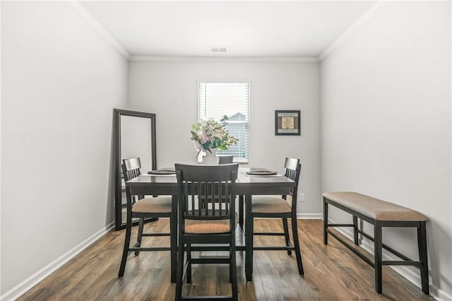 3135 Ellenton Dr, Lithia Springs, GA 30122 - dining area with visible vents, ornamental molding, dark wood finished floors, and baseboards