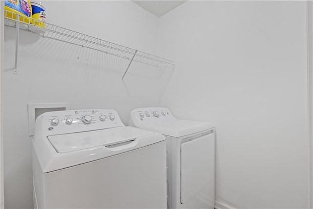 laundry room with washing machine and dryer and laundry area