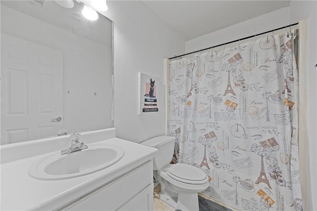 bathroom with toilet, a shower with shower curtain, and vanity